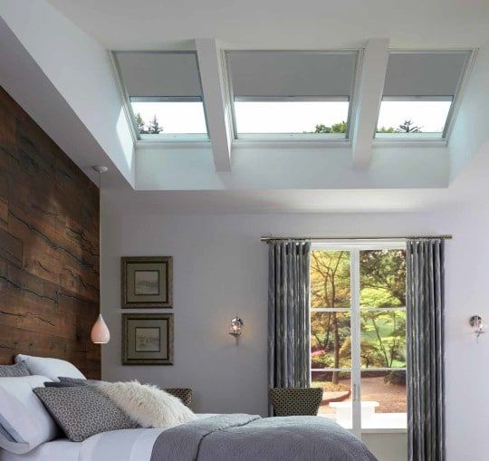 bedroom with beautiful multipanel skylight