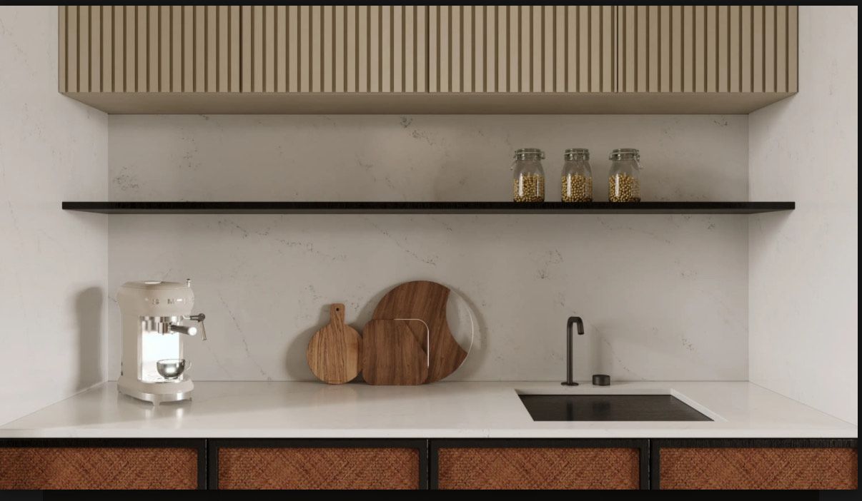 Modern kitchen with white countertops, wooden shelves, and cabinets. Includes sink, coffee machine, and cutting boards.
