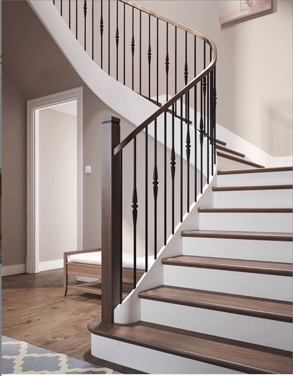 Staircase with wooden steps and a dark railing, leading upward with a curved design.