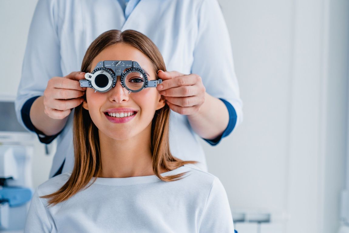 female patient checking vision in ophthalmological clinic