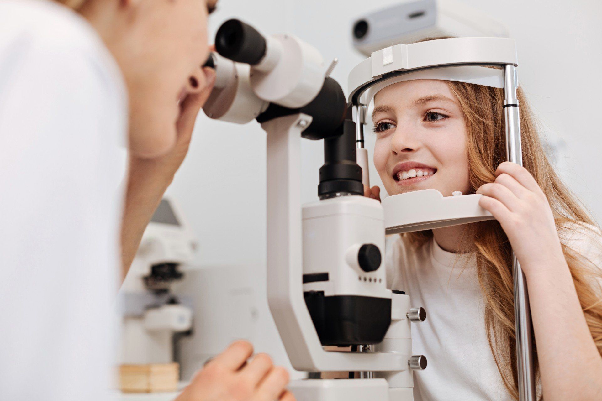 woman having her eyes examined by an ophthalmologist