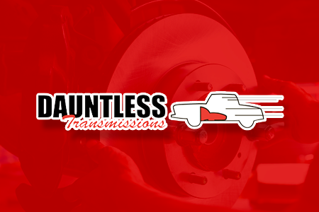 Dauntless Transmissions logo with red truck, text, and blurred mechanical background.
