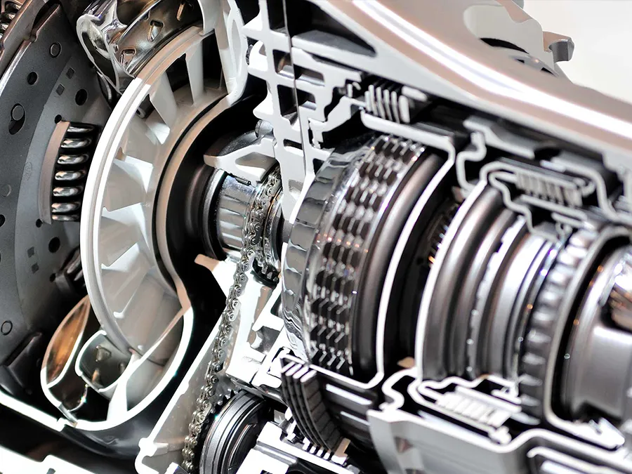 Cutaway view of an automatic transmission, revealing gears, turbines, and various mechanical components.