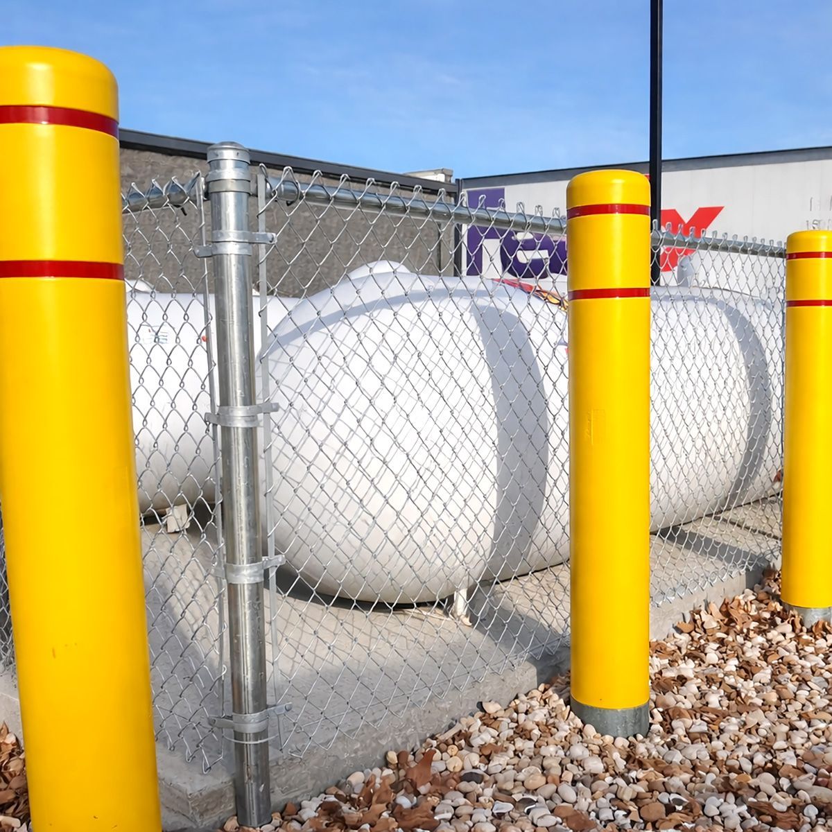 A chain link fence with a gate on a white background.