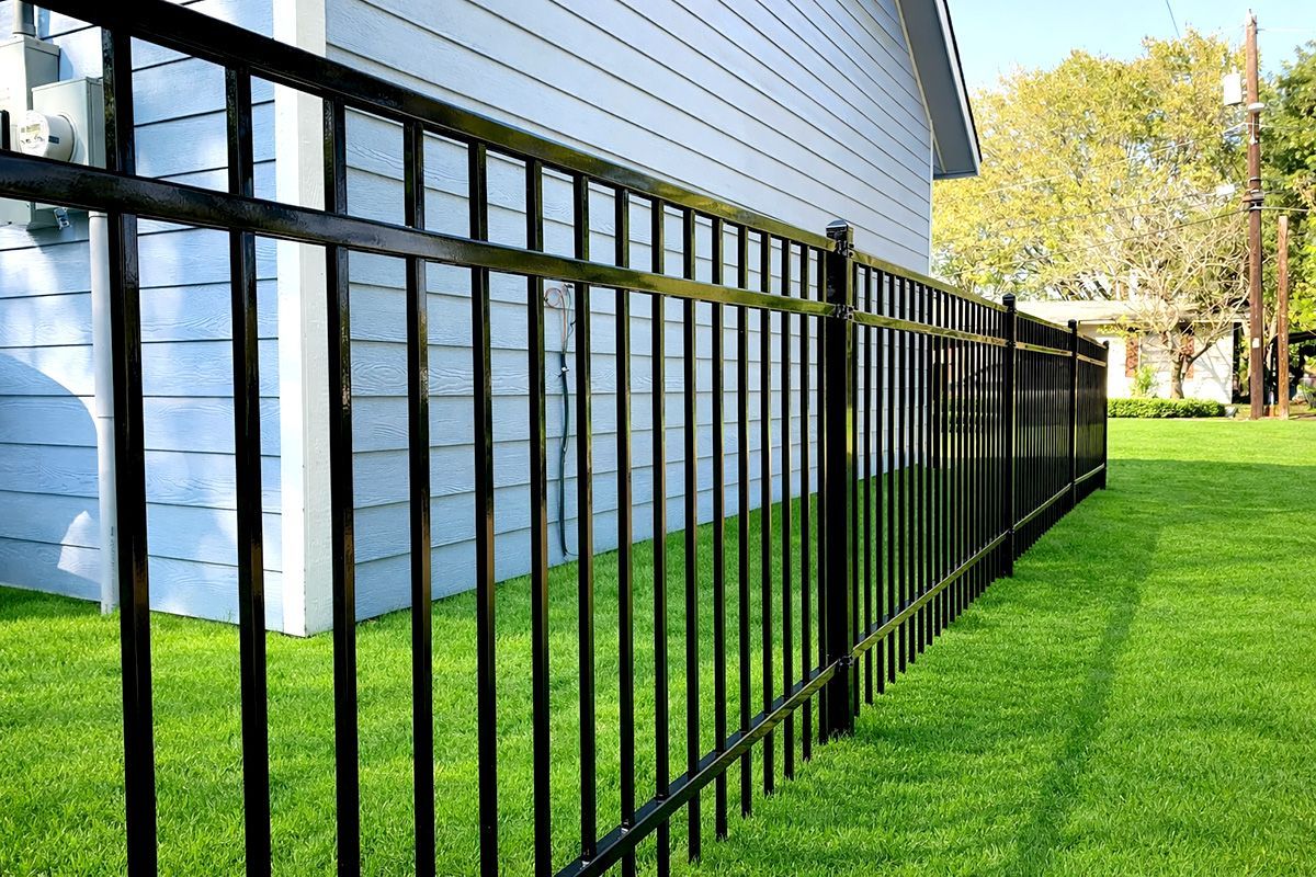 A black metal fence is shown on a white background.