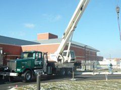 Company Truck Beside The Building — Berlin Heights, OH — Leimeister Crane & Tree Service