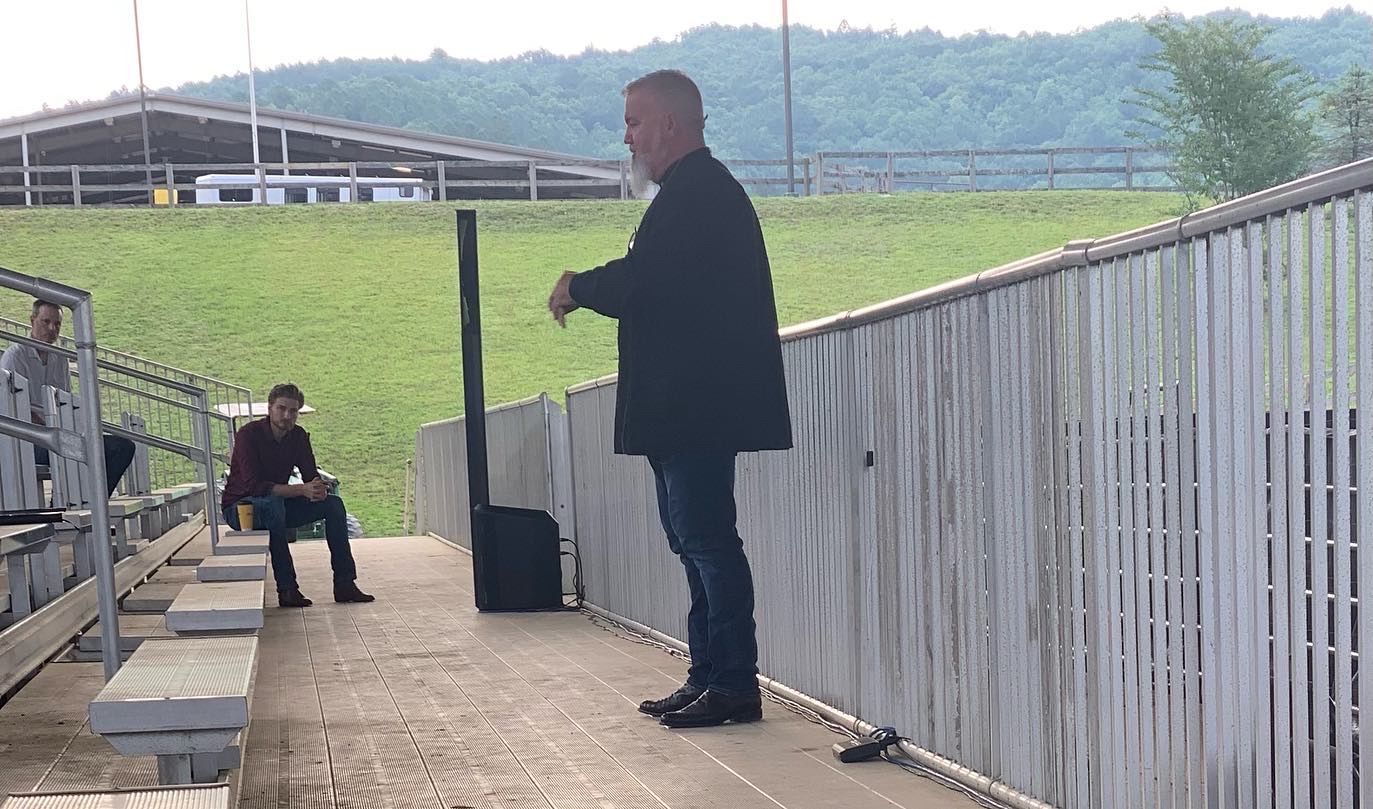 sharing Gospel at team roping