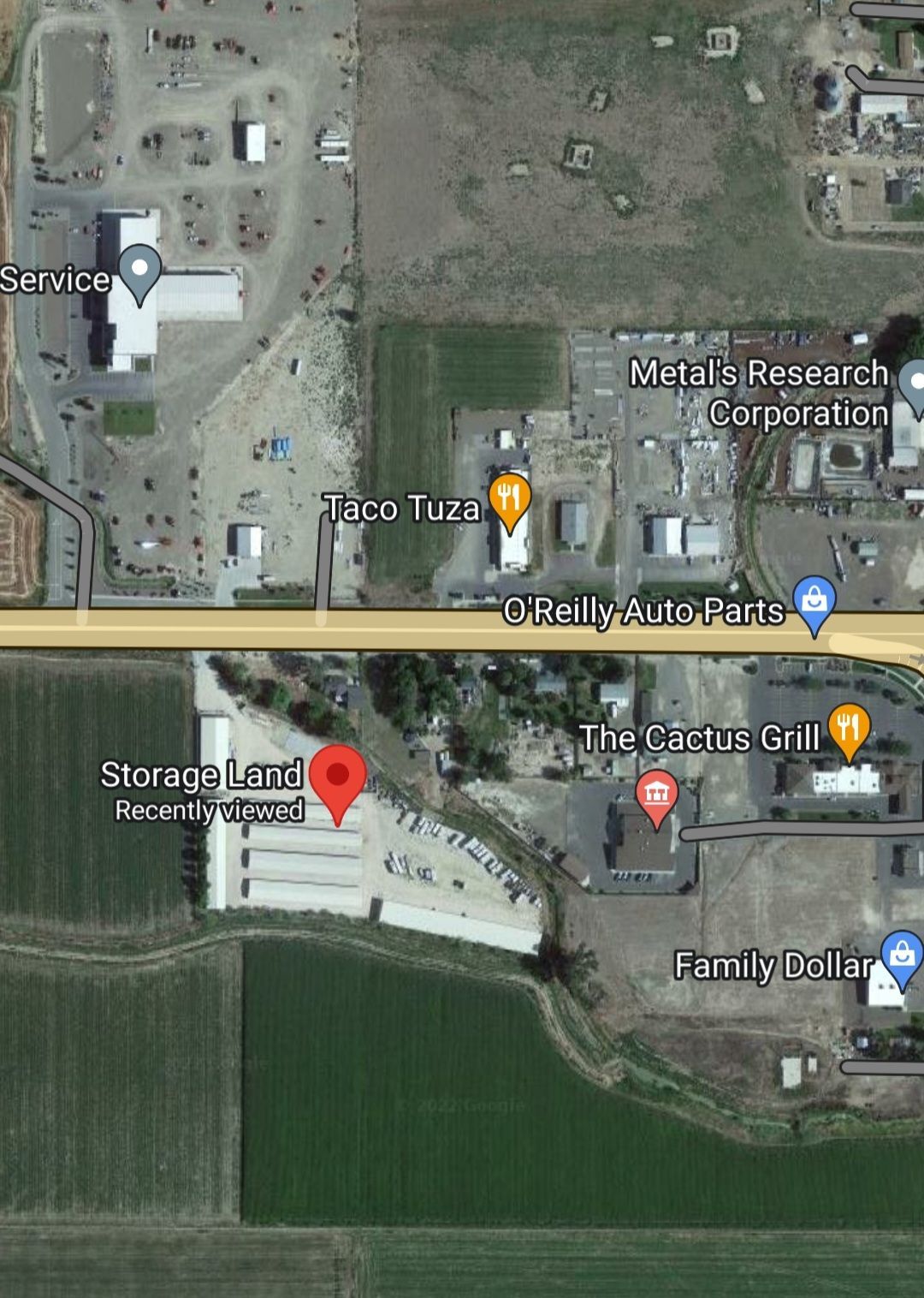 An aerial view of a city with a red circle in the middle