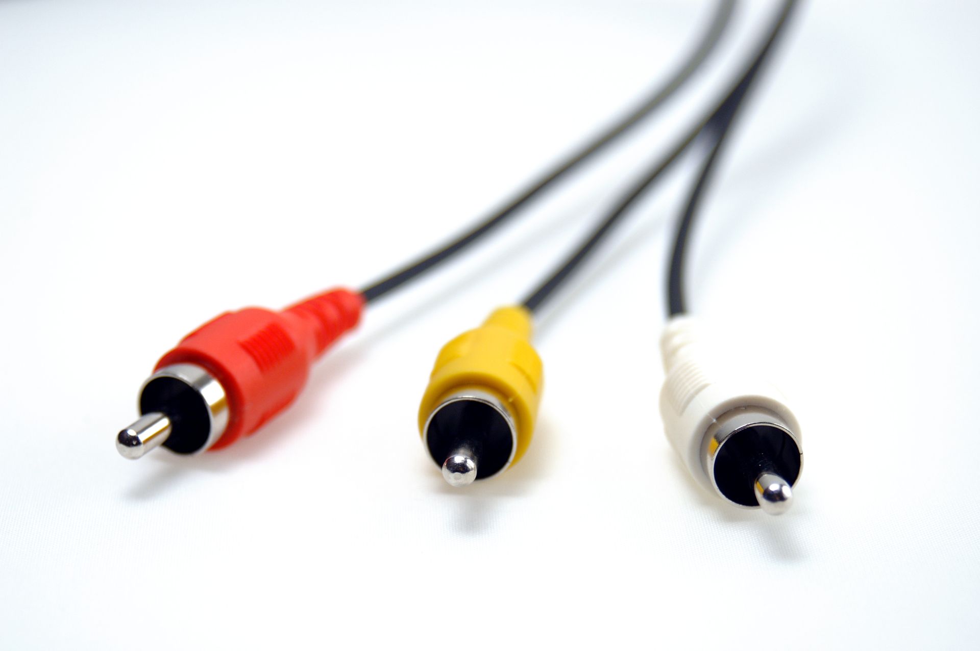 A close up of three rca connectors on a white surface