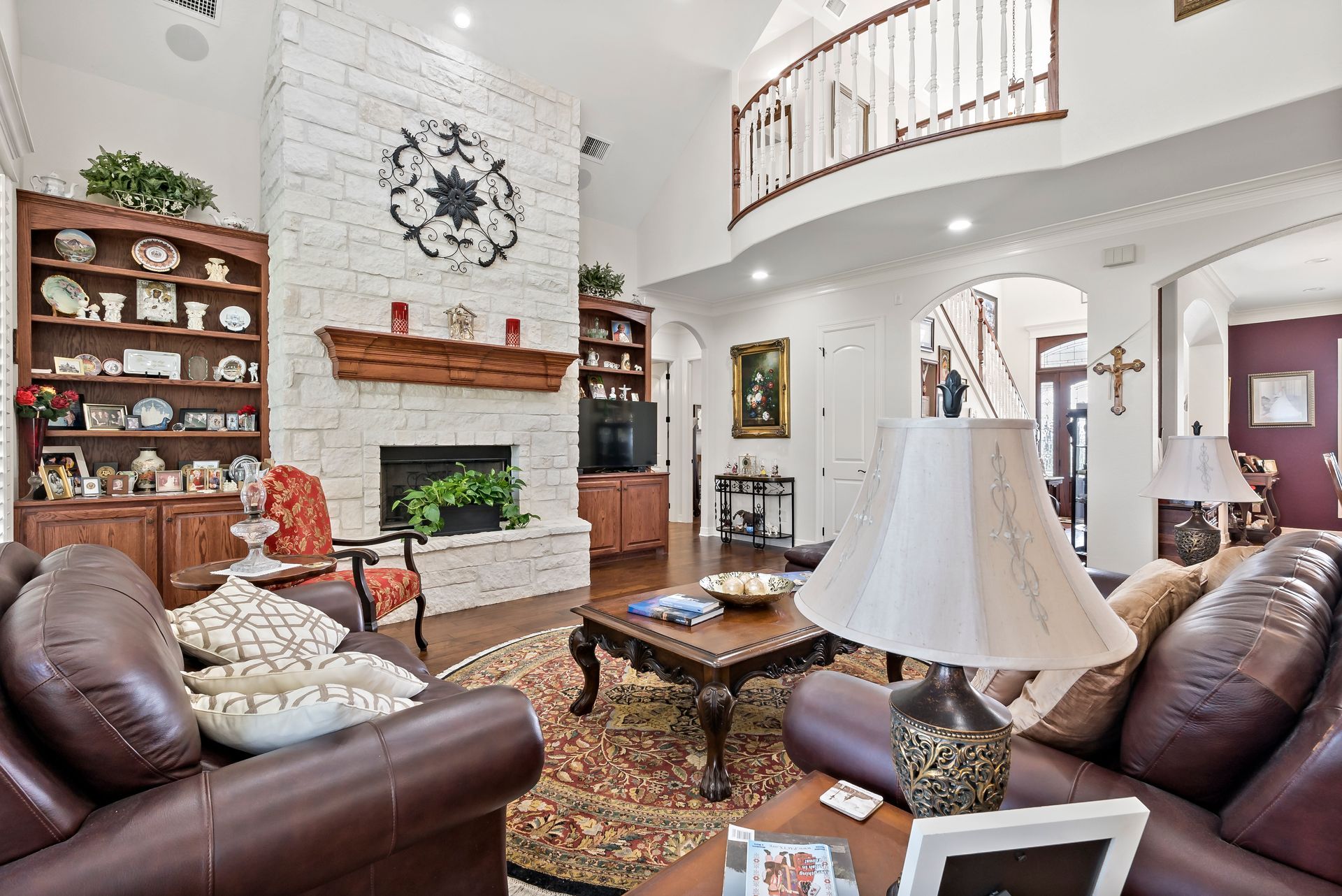 A living room filled with furniture and a fireplace.