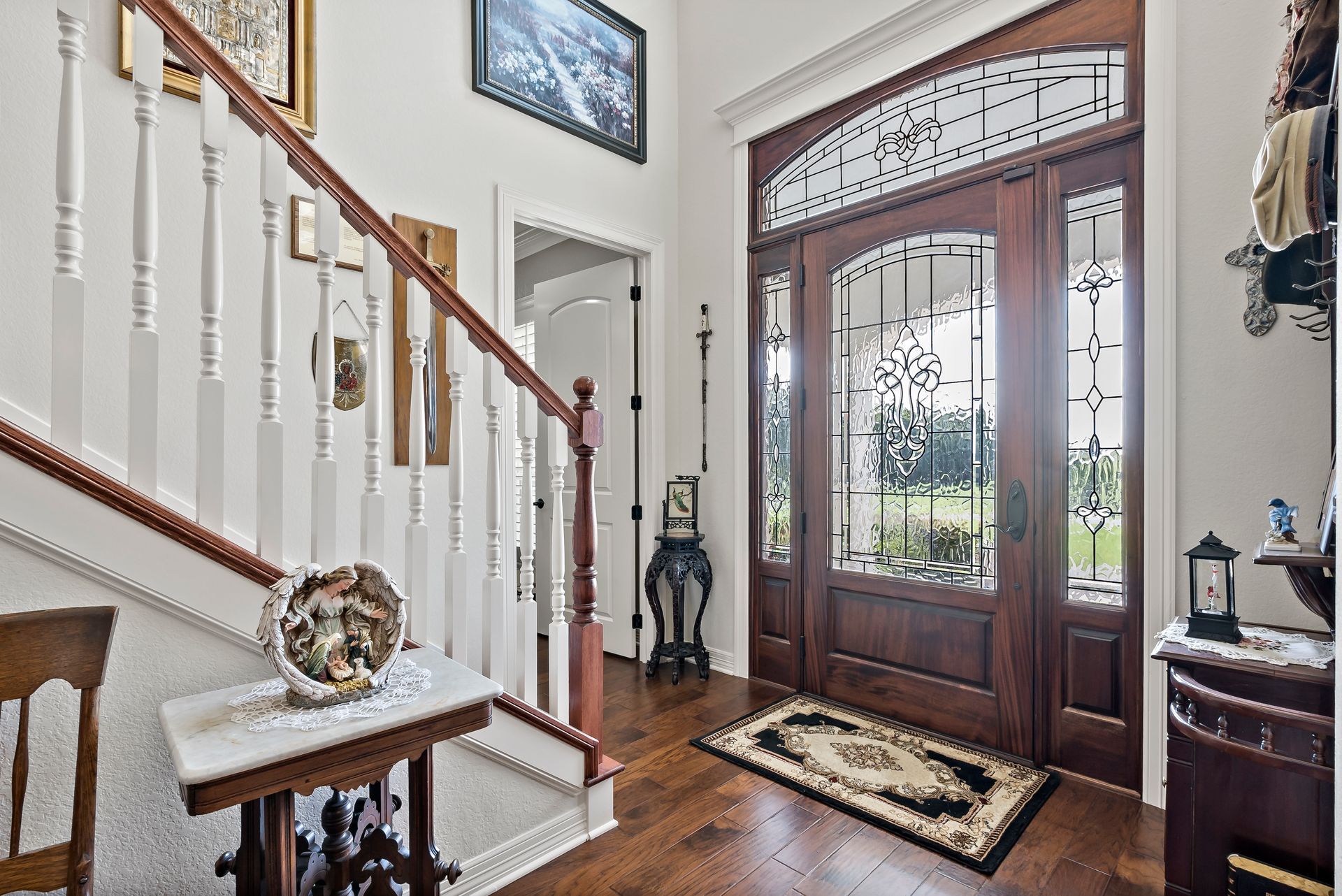 There is a staircase leading up to the front door of a house.