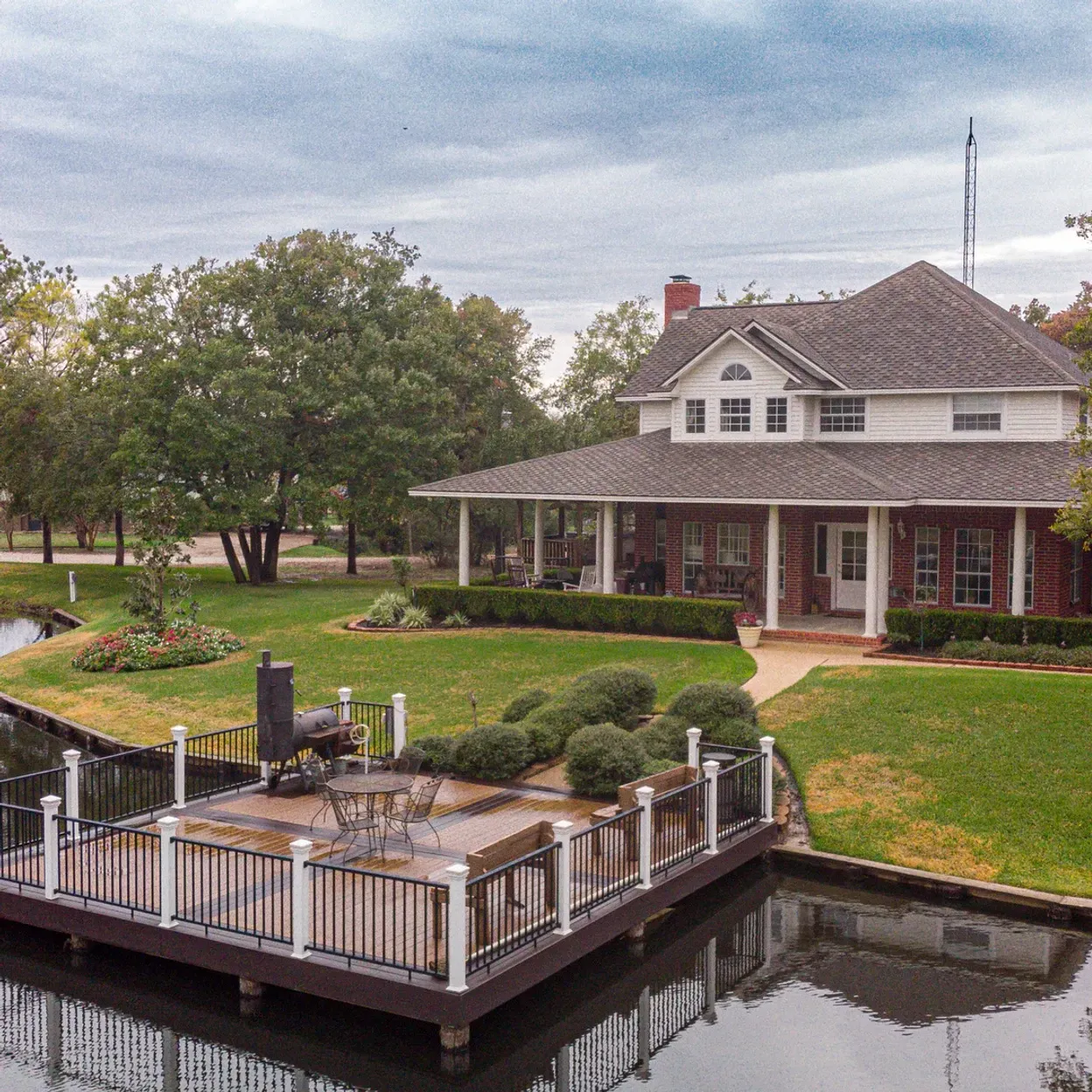 A large house with a dock in front of it