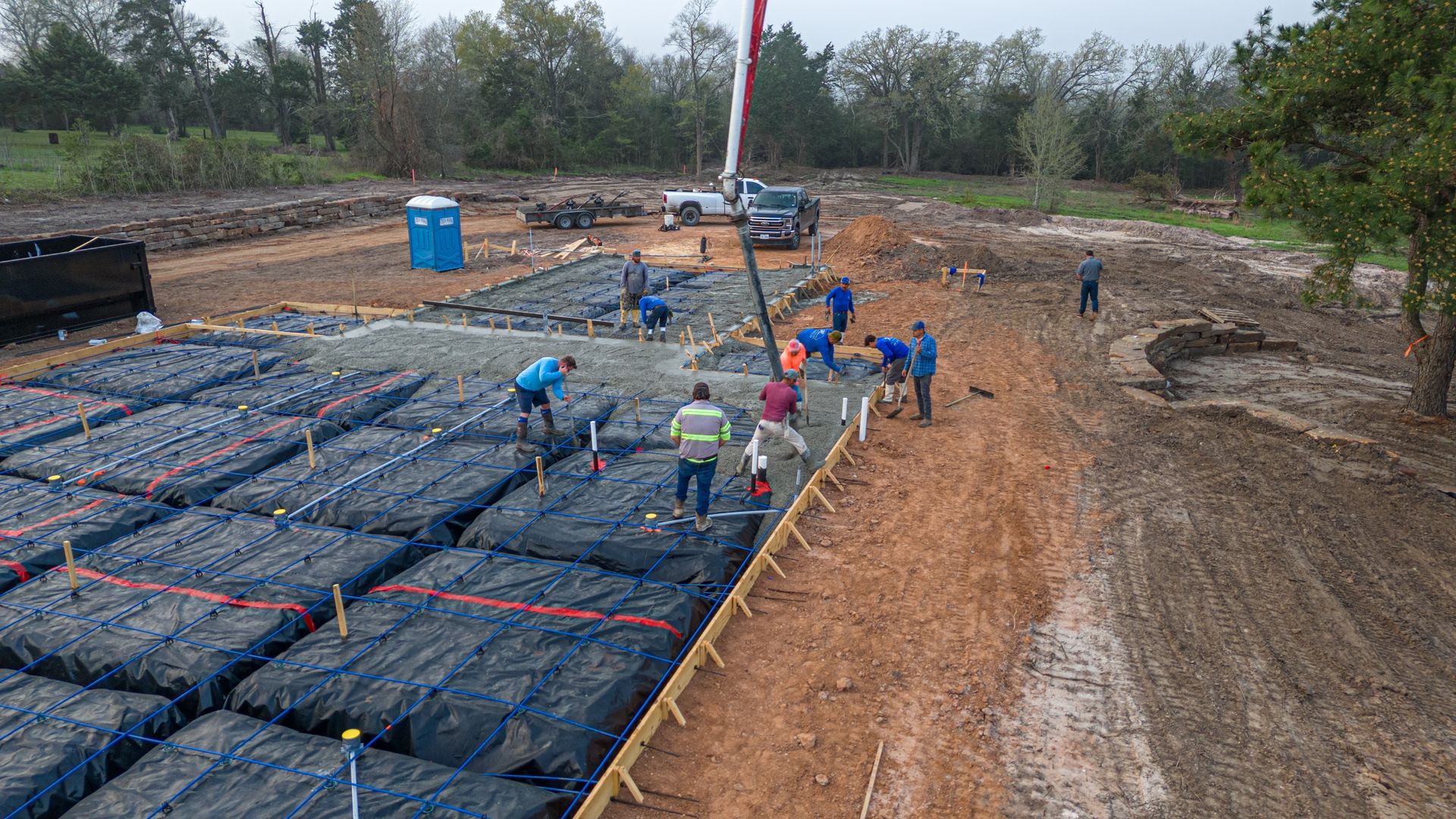 A group of construction workers are working on a construction site.
