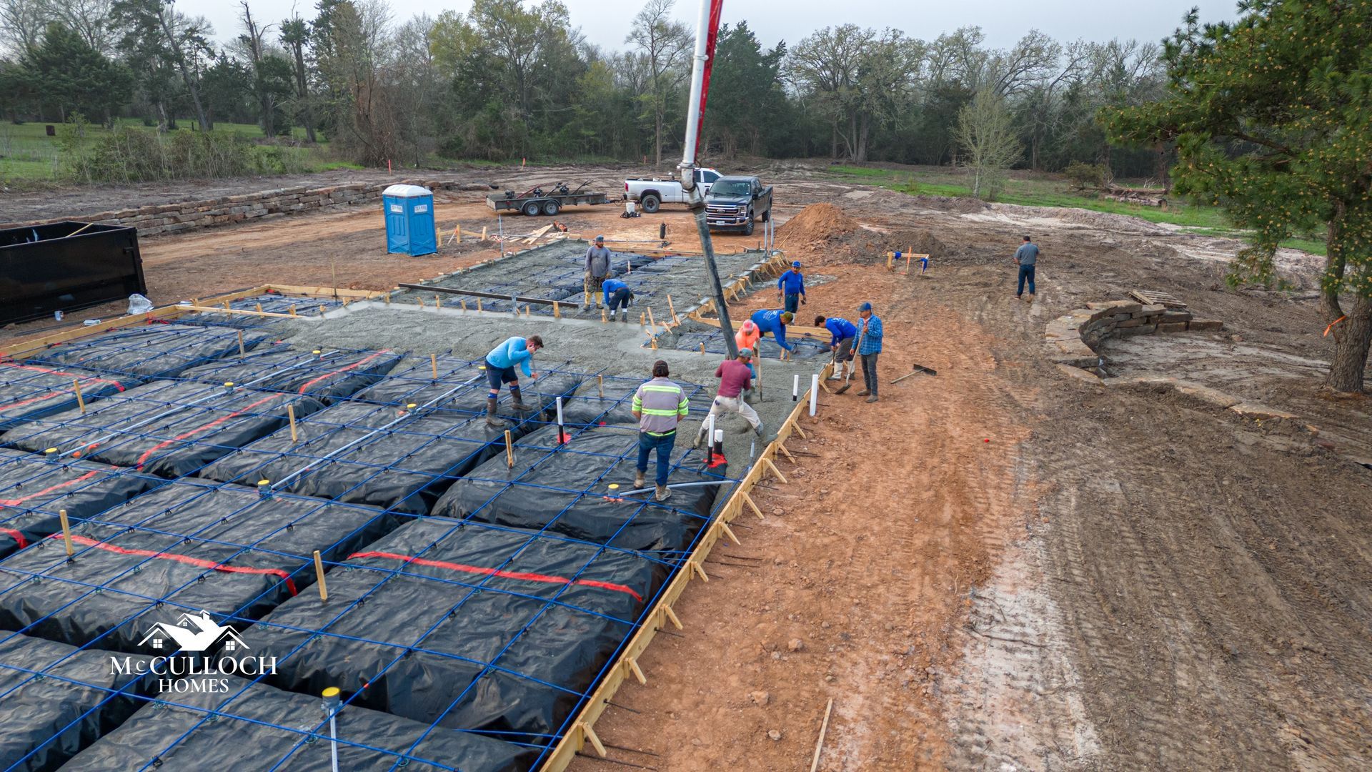 A group of construction workers are working on a construction site.