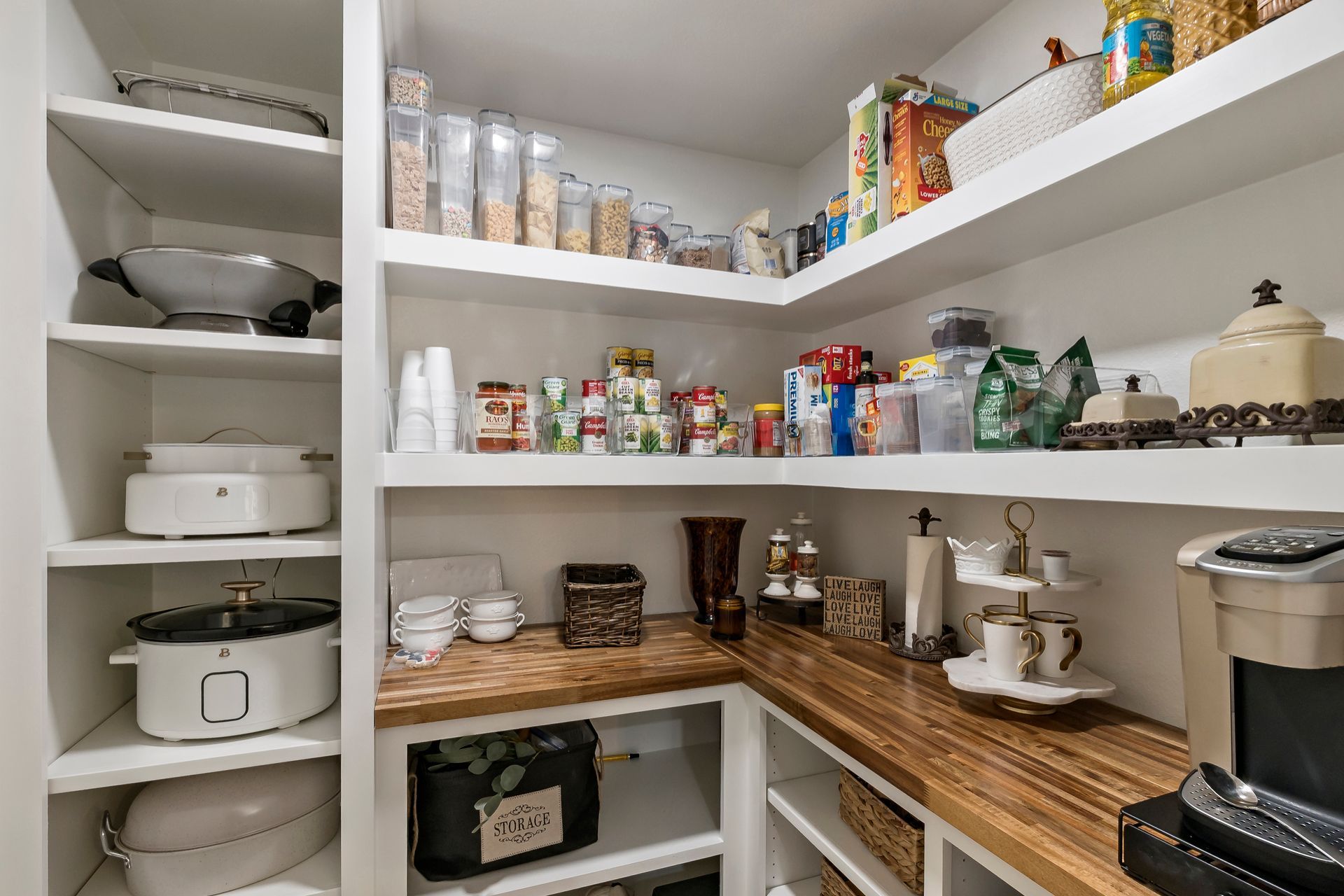 A pantry filled with lots of food and appliances.
