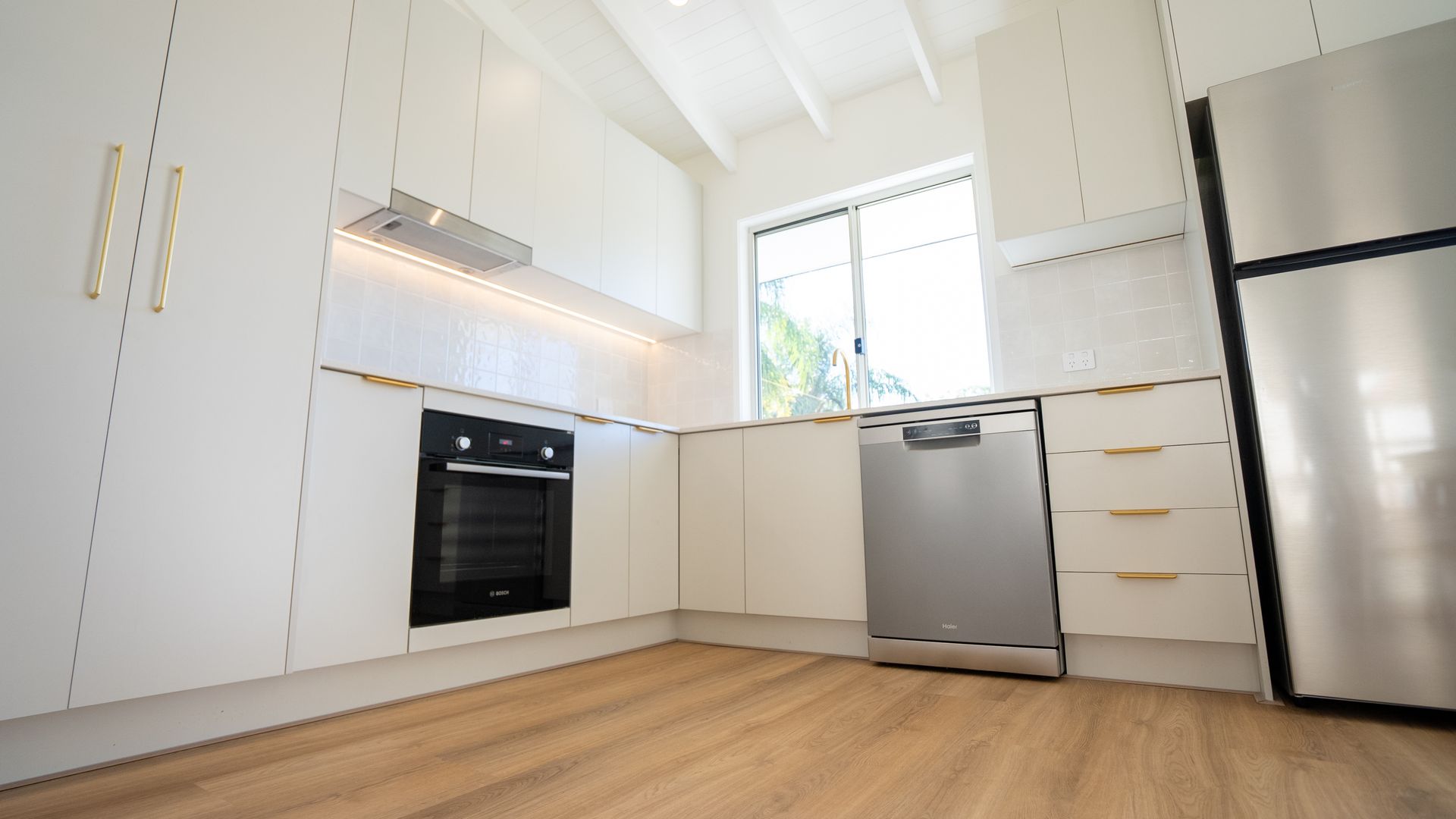 white and gold custom kitchen in Brisbane by WCC Kitchens and Cabinets