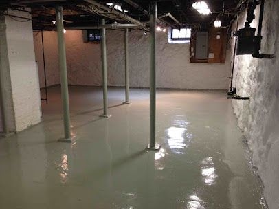 A basement filled with plastic wrap and air ducts.
