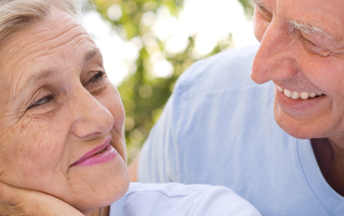 Happy elderly couple smiling