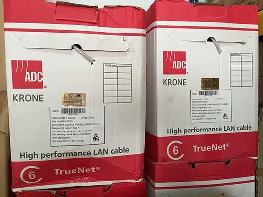 Two boxes of ADC Krone TrueNet CAT6 LAN cable, red and white, labeled 
