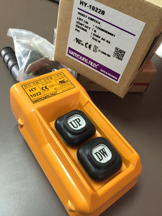 Yellow hoist control with black 