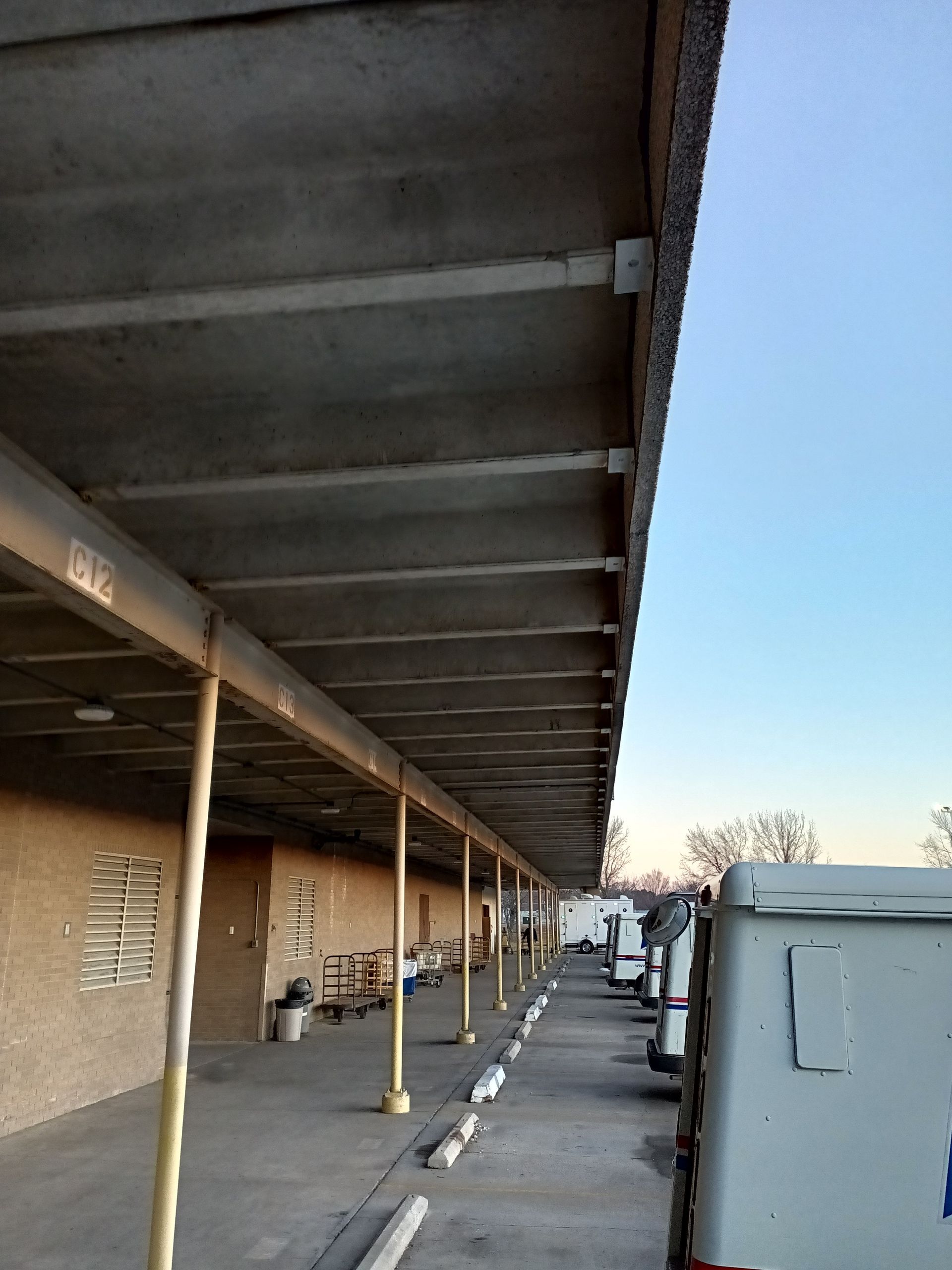 Exterior loading dock area before commercial sealing and line striping