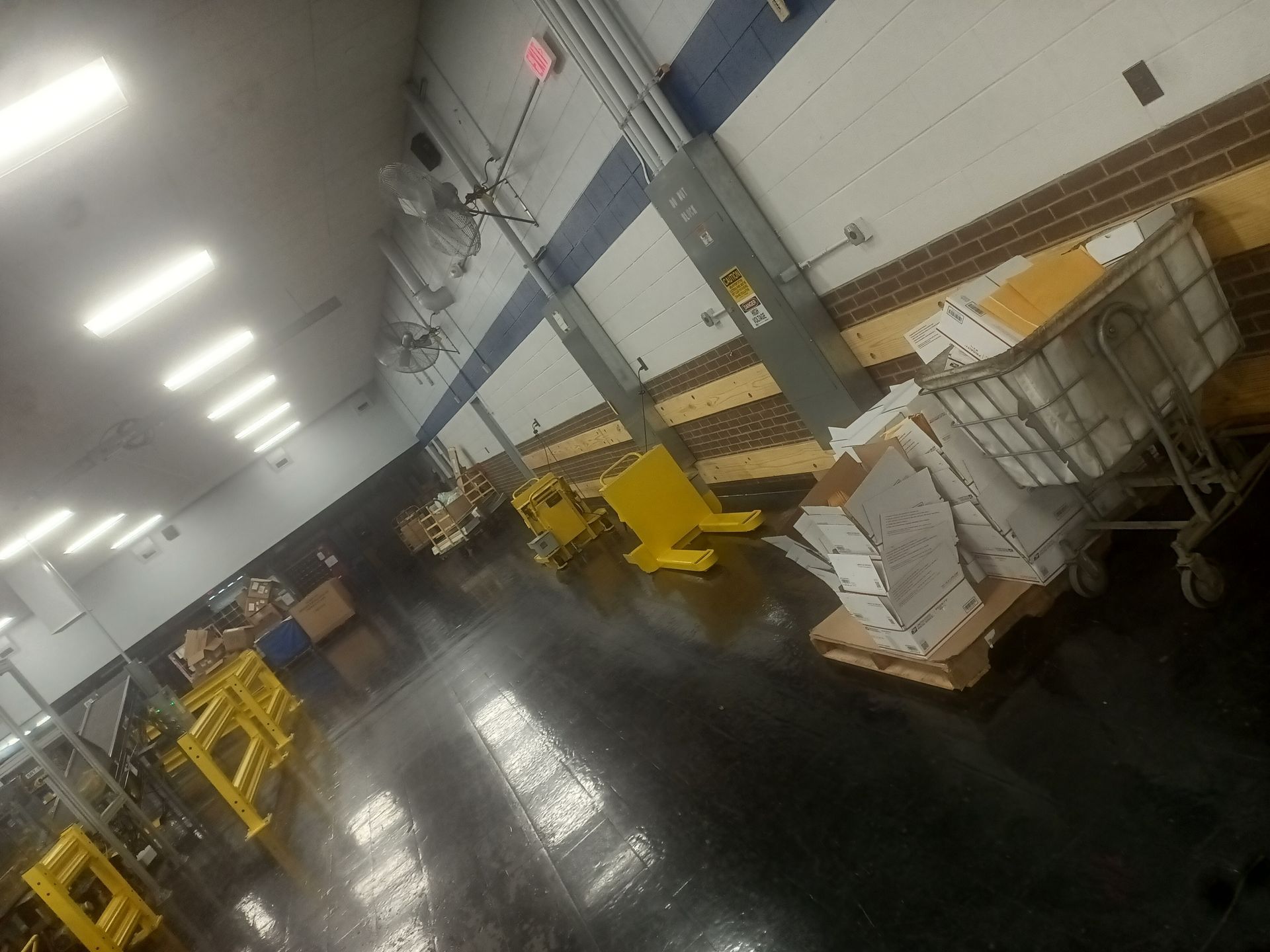 Industrial space with black epoxy floor coating after sealing and commercial floor prep