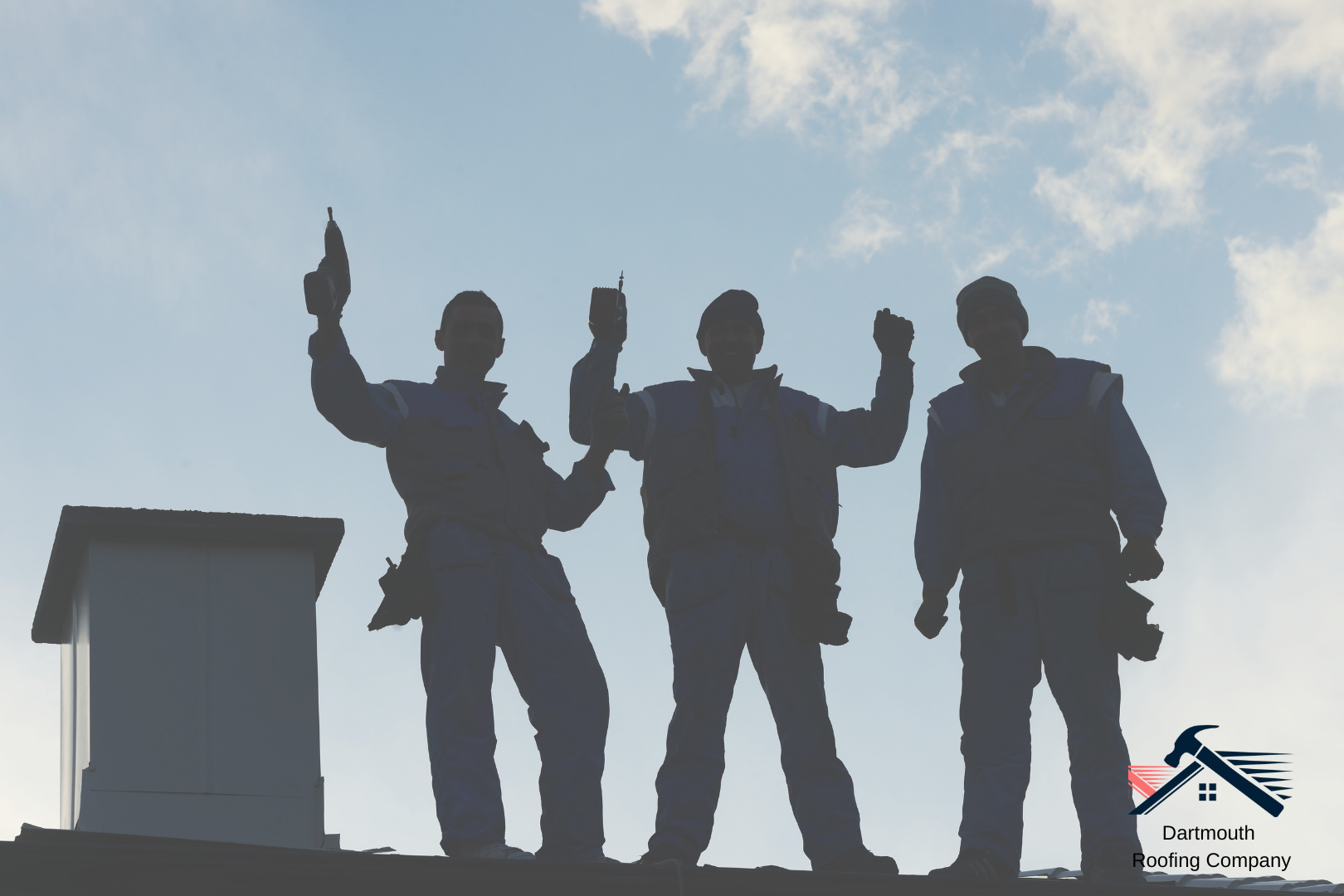 Roofing company workers from Dartmouth Expert Roofing on a roof