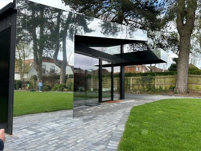  A residential; building with a mirrored facade.