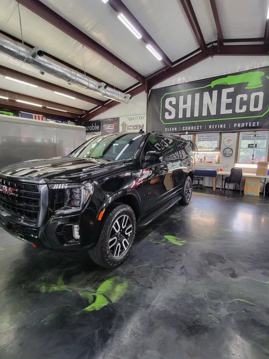 ceramic coating application in a black car.
