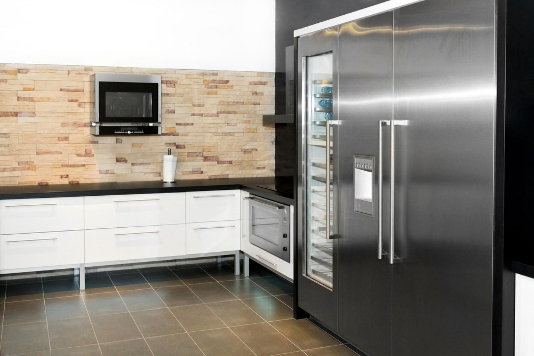 A Kitchen with A Stainless Steel Refrigerator and A Microwave — JDG Refrigeration & Air in Goonellabah, NSW