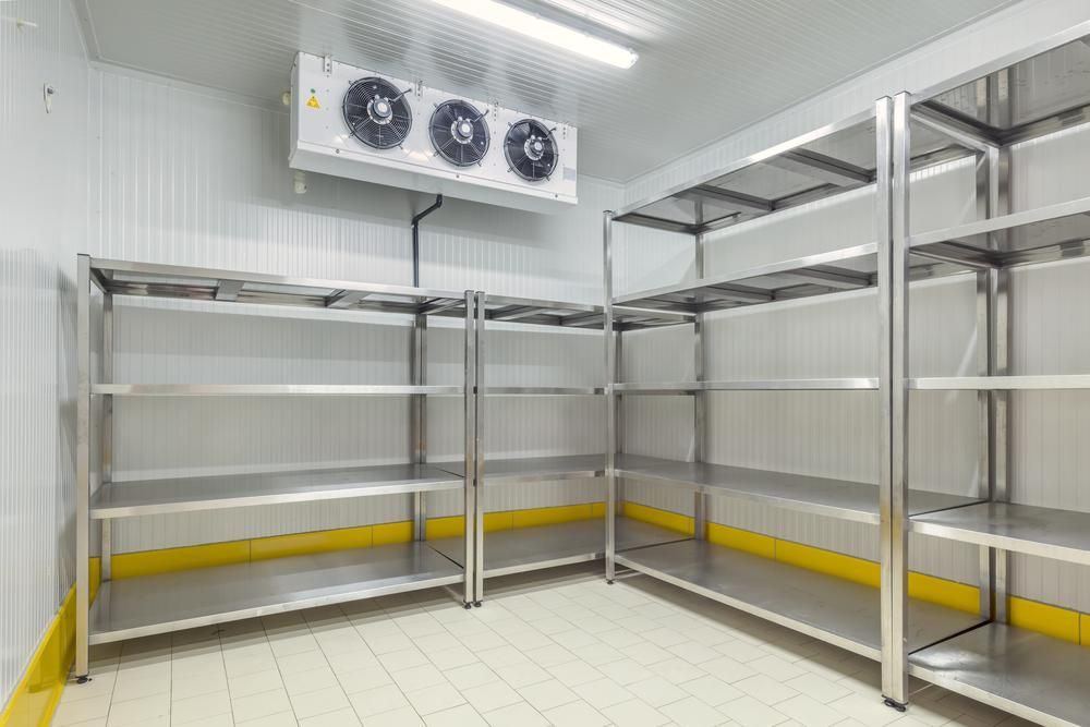 A Room with Stainless Steel Shelves and A Refrigerator — JDG Refrigeration & Air in Goonellabah, NSW