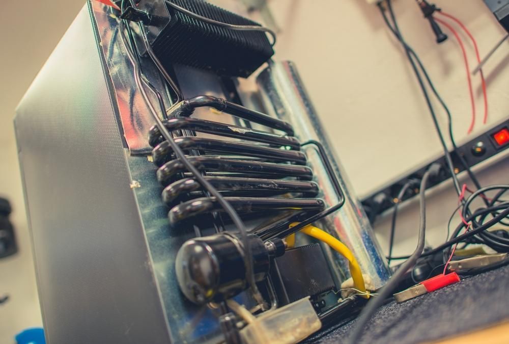 A Computer Is Sitting on A Table — JDG Refrigeration & Air in Byron Bay, NSW