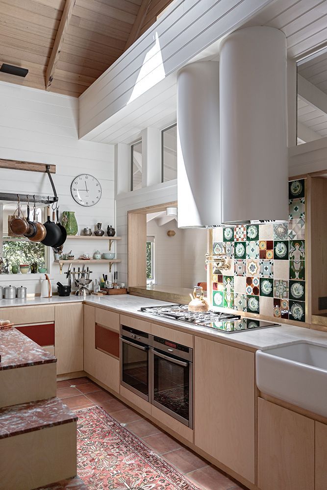 Bright Kitchen with Light Timber Cabinets, Tiled Splashback, and a Rug — BSpoke Cabinet Making & Joinery in Unanderra, NSW