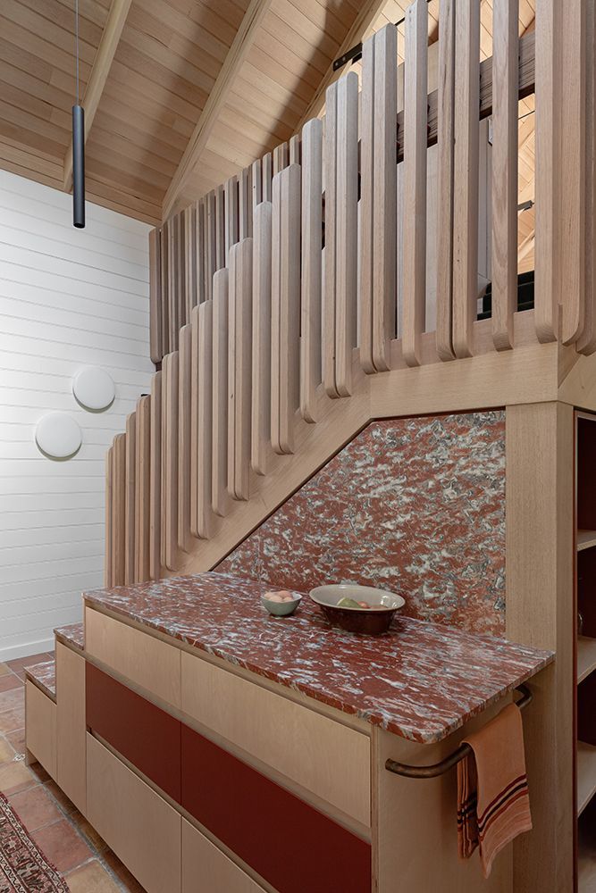 Timber Staircase with Decorative Timber Slats, Red Benchtop and Cabinetry — BSpoke Cabinet Making & Joinery in Unanderra, NSW