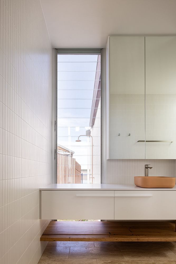 White Bathroom with a Window Showing the Shower — BSpoke Cabinet Making & Joinery in Unanderra, NSW