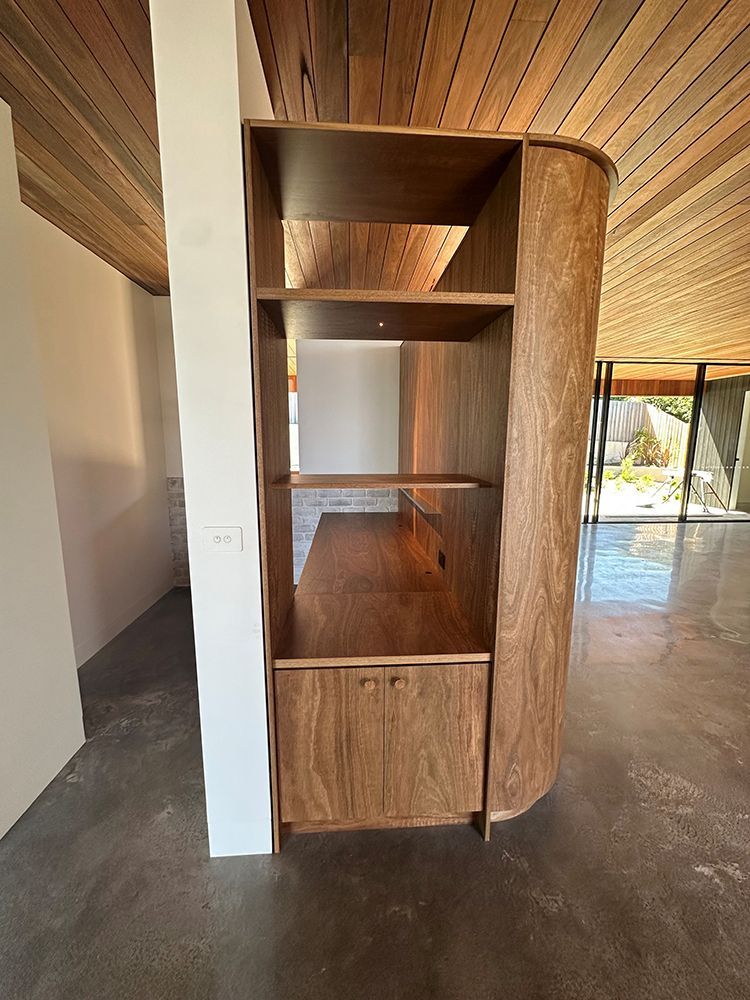 Wooden Built-in Cabinet with Shelves and Curved Side — BSpoke Cabinet Making & Joinery in Unanderra, NSW