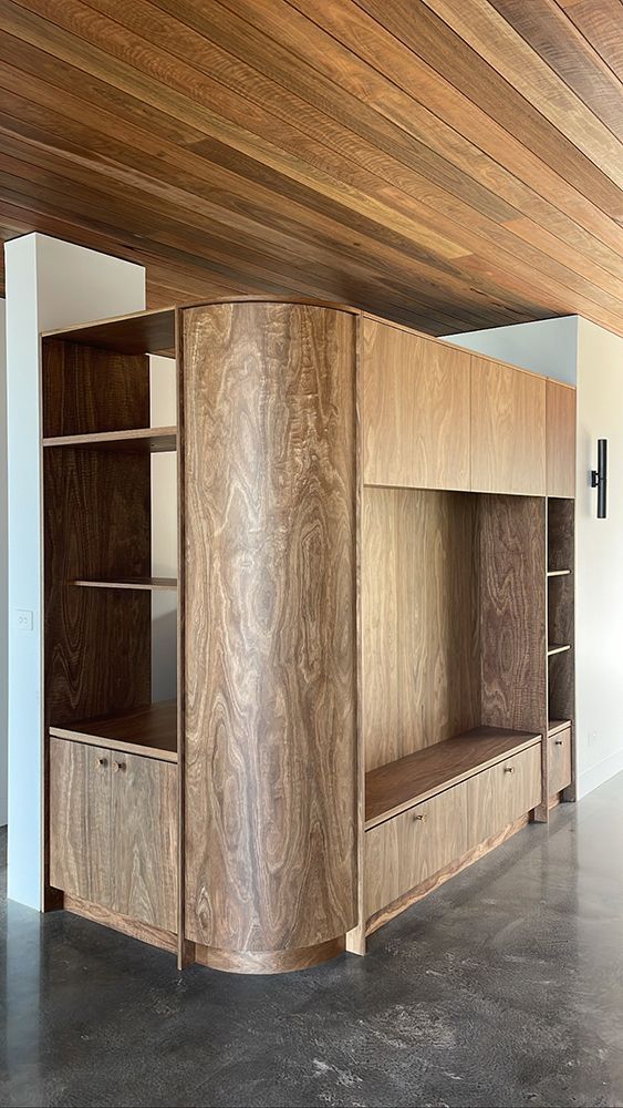 Wooden Built-in Storage Unit with Shelves, Cabinets, and Curved Corner — BSpoke Cabinet Making & Joinery in Unanderra, NSW