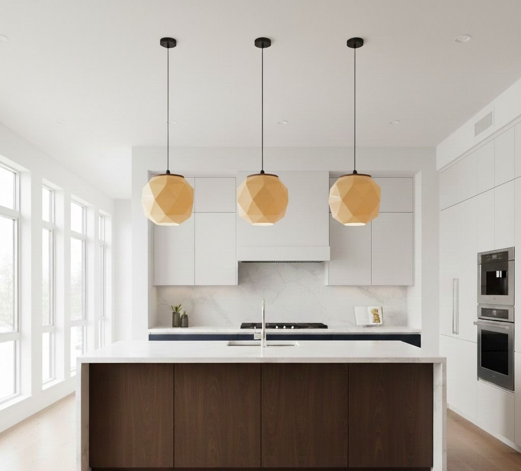 Cocina moderna con tres luces colgantes sobre una isla de madera oscura y gabinetes blancos.