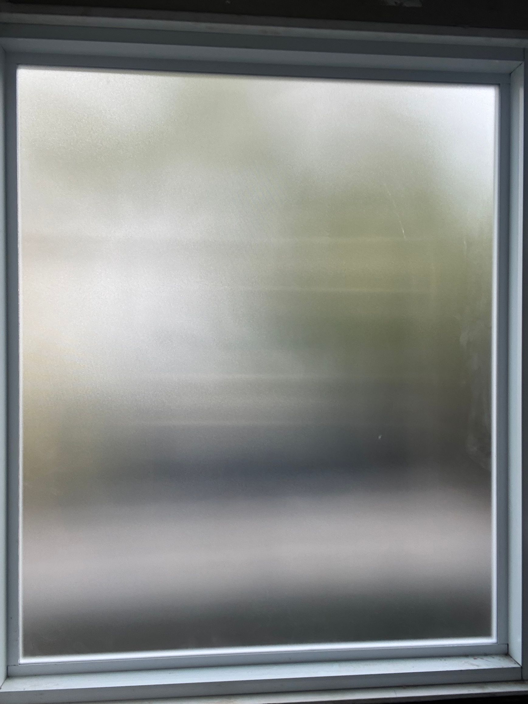 Hand adjusting a window latch on a white-framed casement window — Kracken Windows and Doors In Terrey Hills, NSW