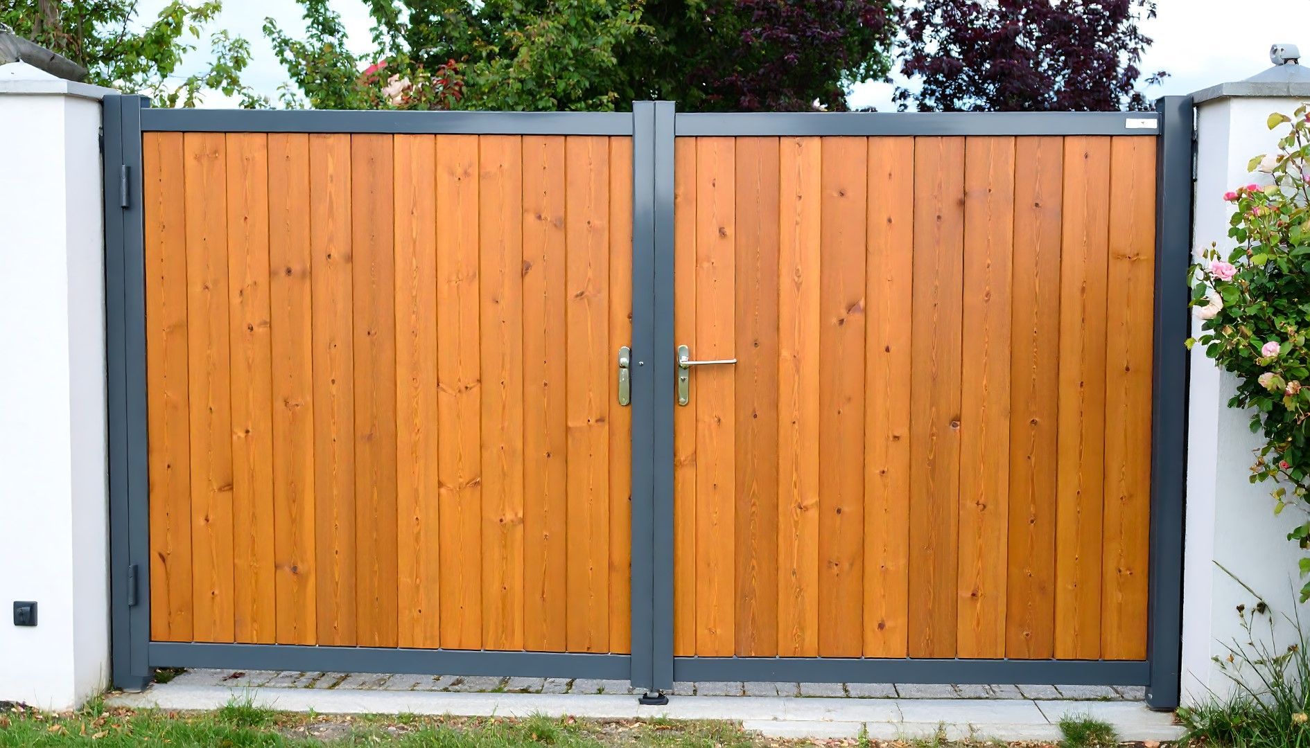 Wooden double gate with gray metal frame.