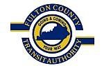 the logo for fulton county transit authority is going and coming your way .