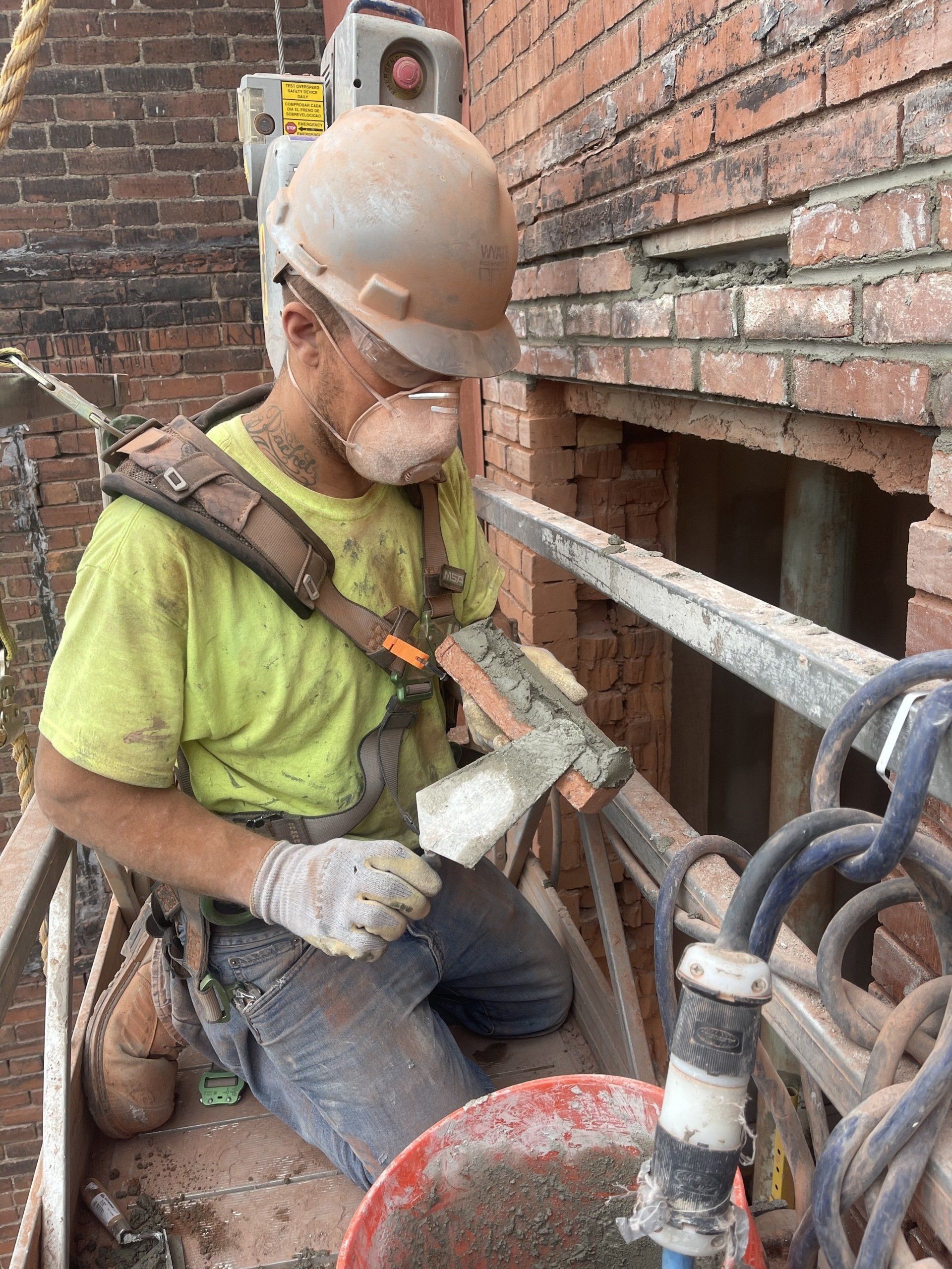Worker Repairing Brick Wall — Uniontown, PA — Sagada Construction