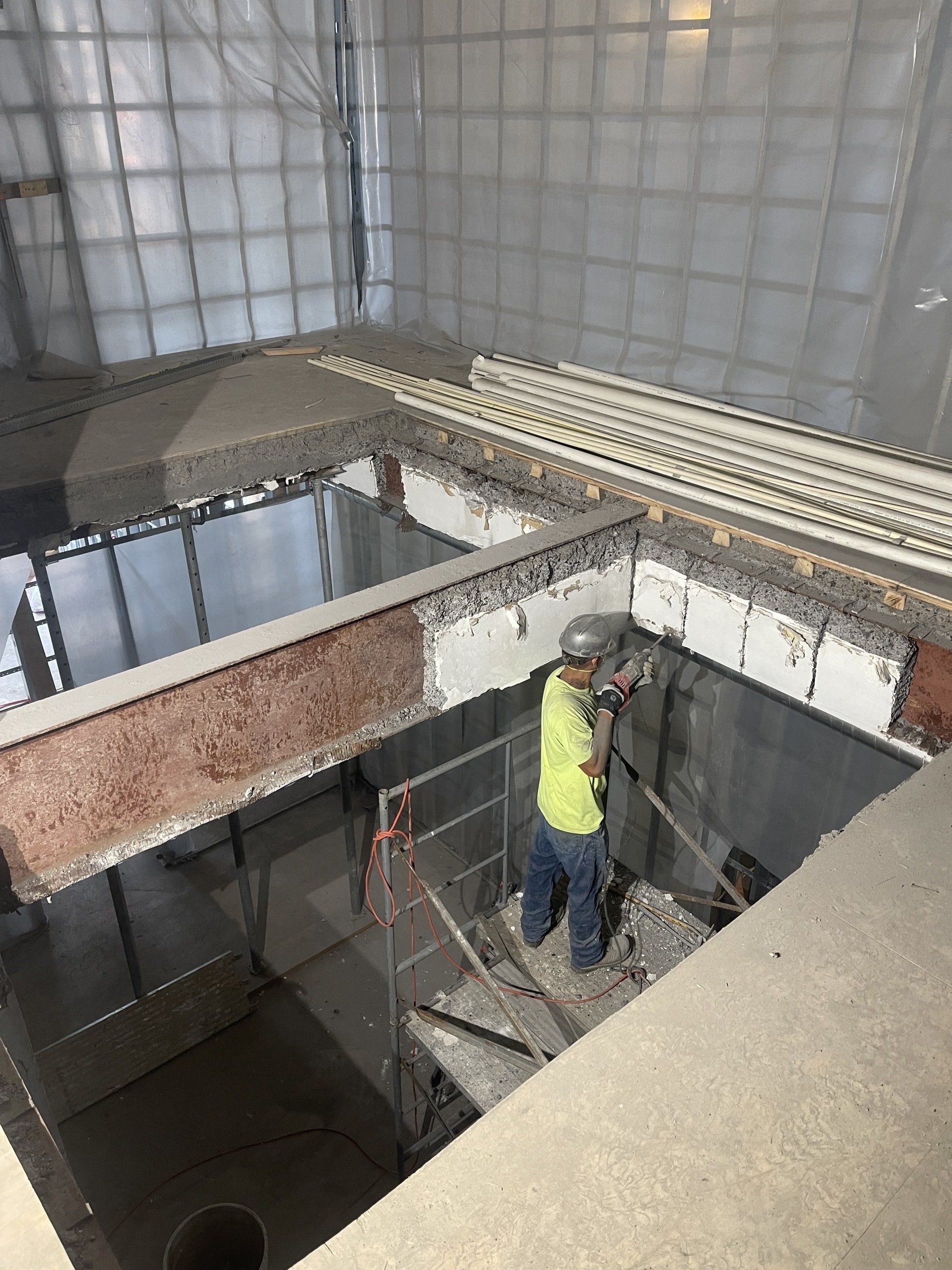 Worker With Safety Helmet In Construction Site — Uniontown, PA — Sagada Construction