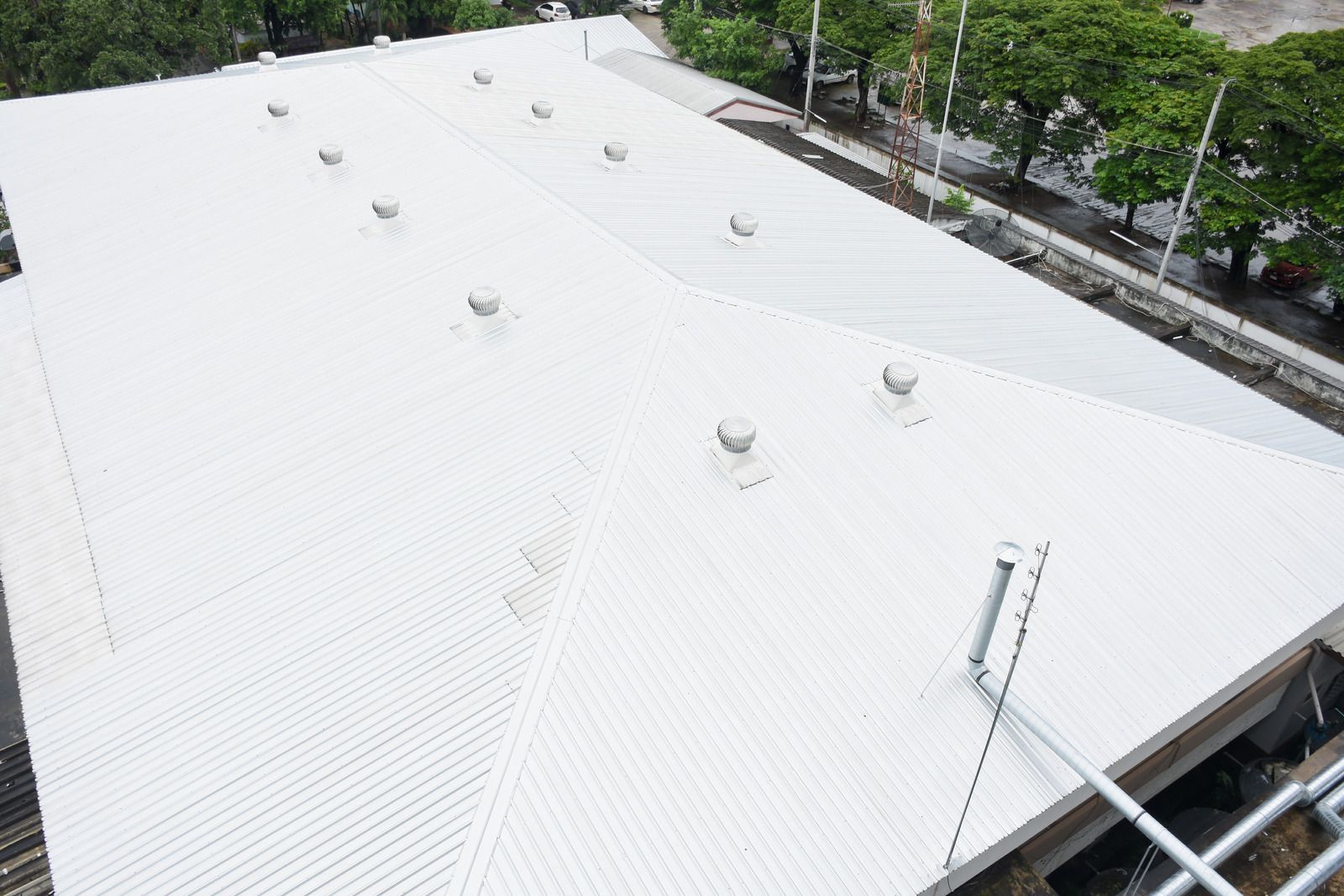 White corrugated metal roof with vents.