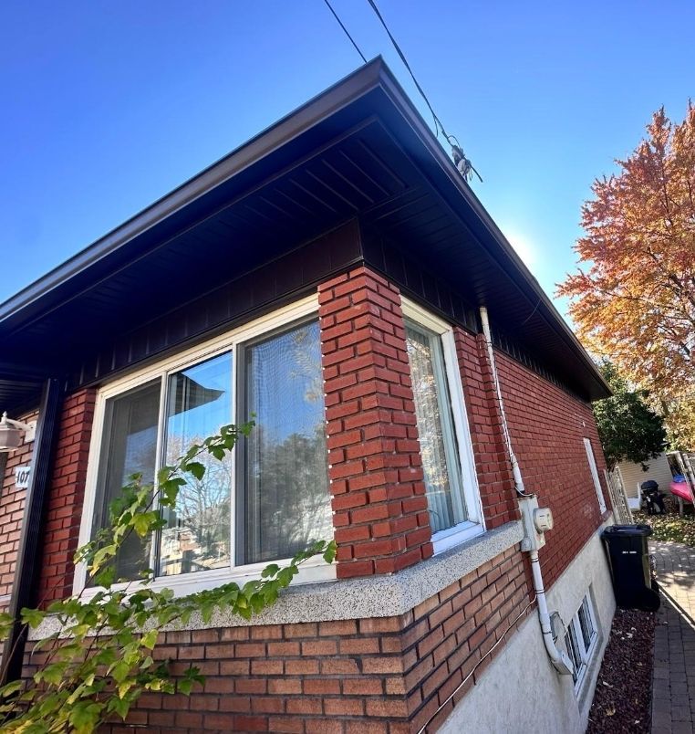 A brick house with a blue sky in the background
