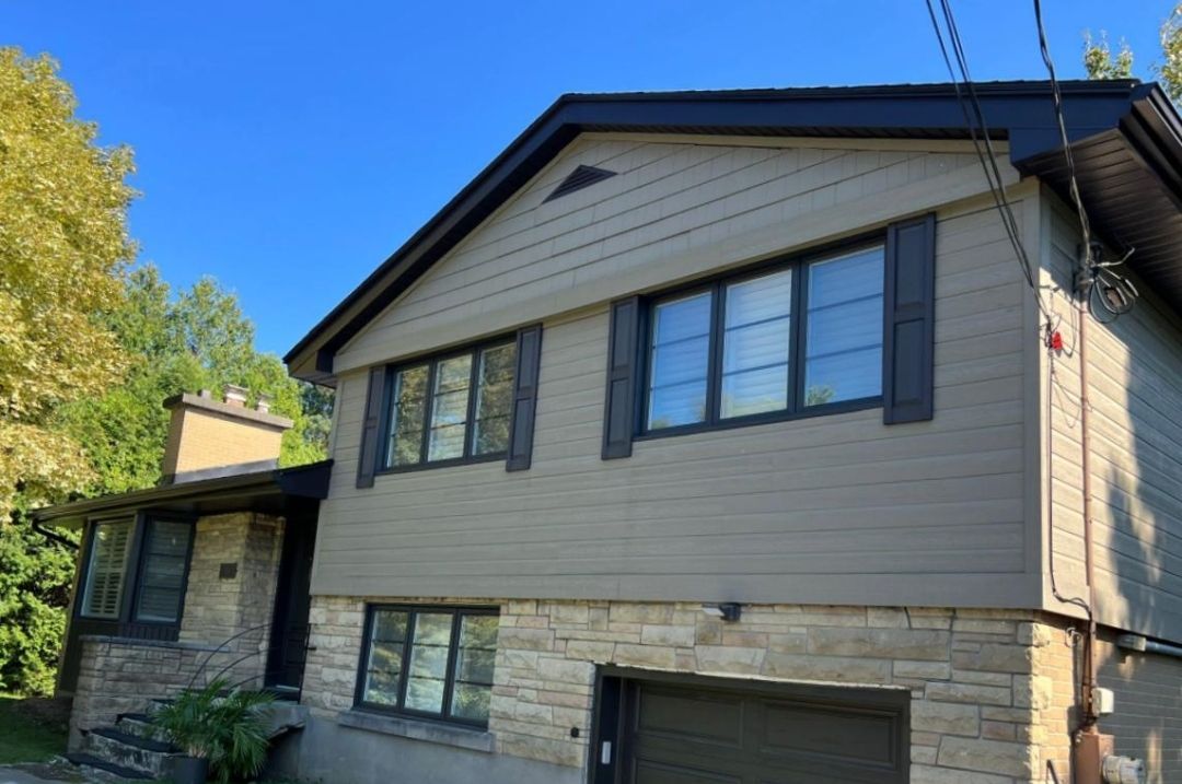 A house with a garage and a lot of windows