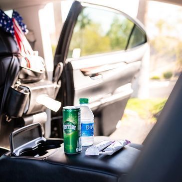Rear seat console with bottled water and other amenities