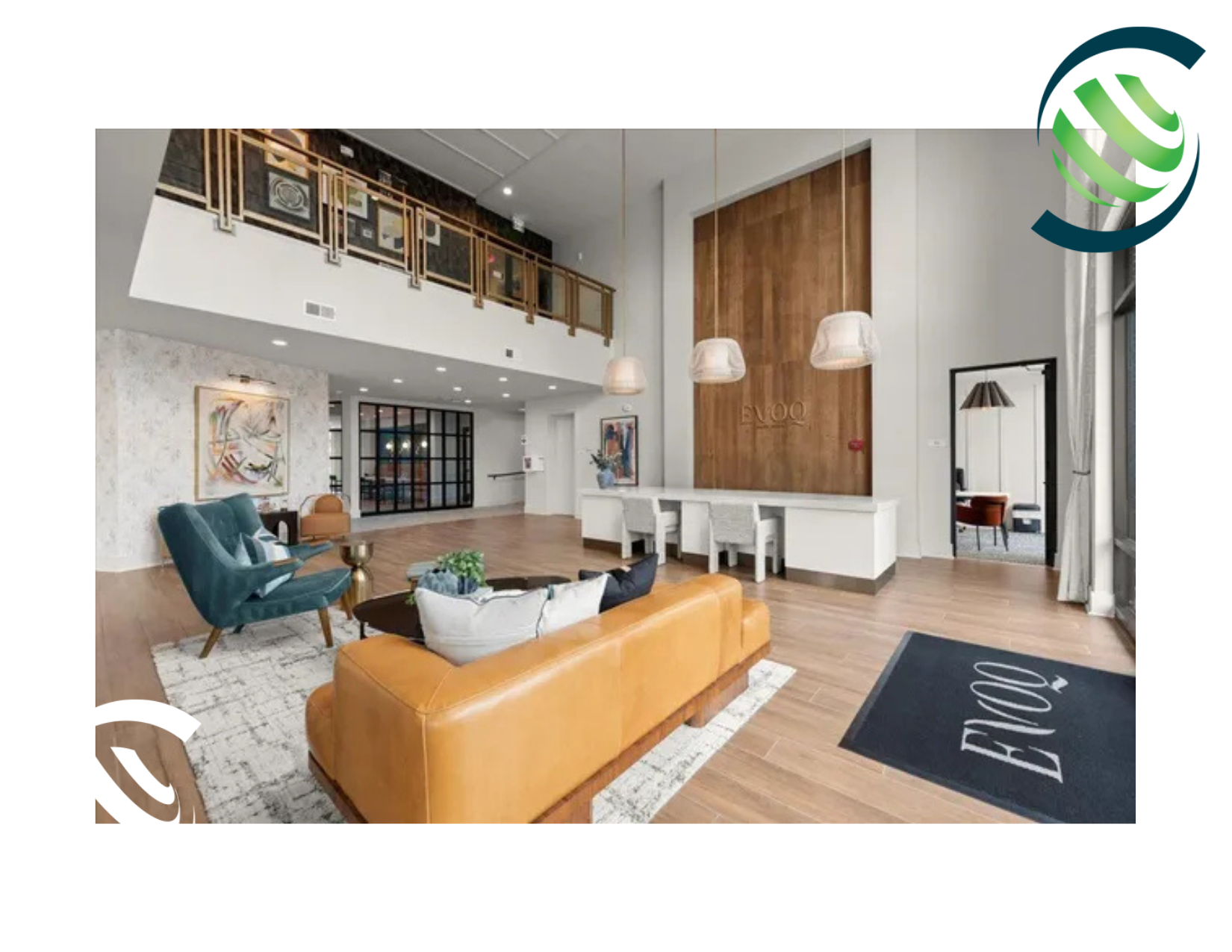 Lobby area with modern furniture, wooden paneling, and a mezzanine level.