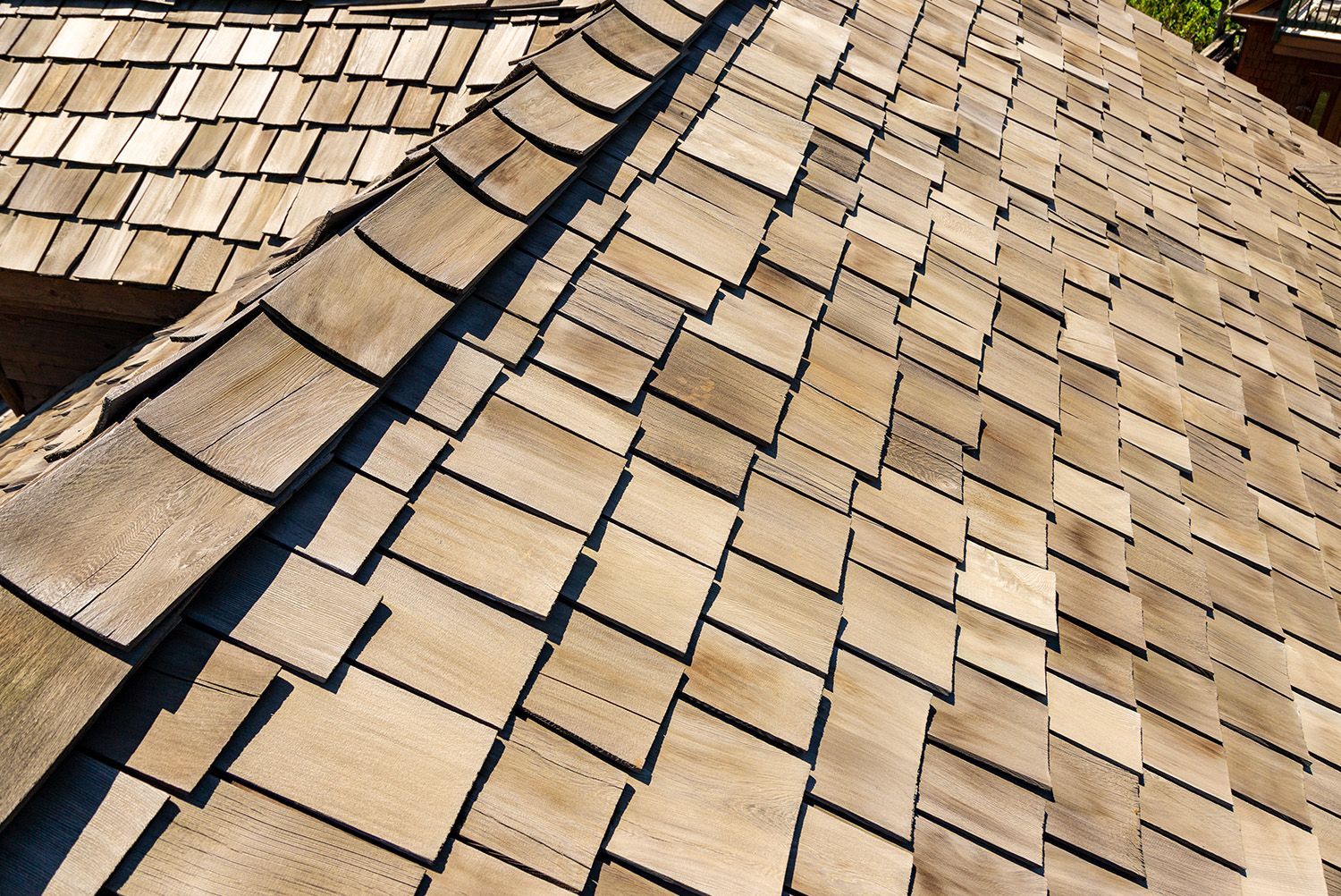 A close up of a wooden roof with shingles