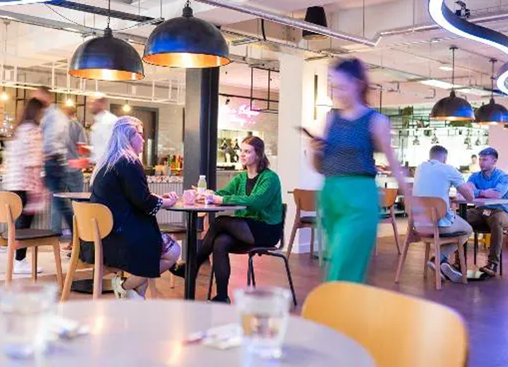 Ocean waves crashing, churning white foam amidst deep teal and turquoise water.